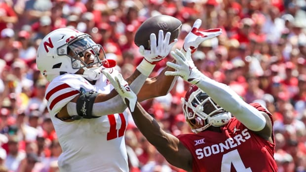 Sep 18, 2021; Norman, Oklahoma, USA; Nebraska Cornhuskers cornerback Braxton Clark (11) breaks up a pass intended for Oklahoma Sooners wide receiver Mario Williams (4) during the fourth quarter at Gaylord Family-Oklahoma Memorial Stadium.